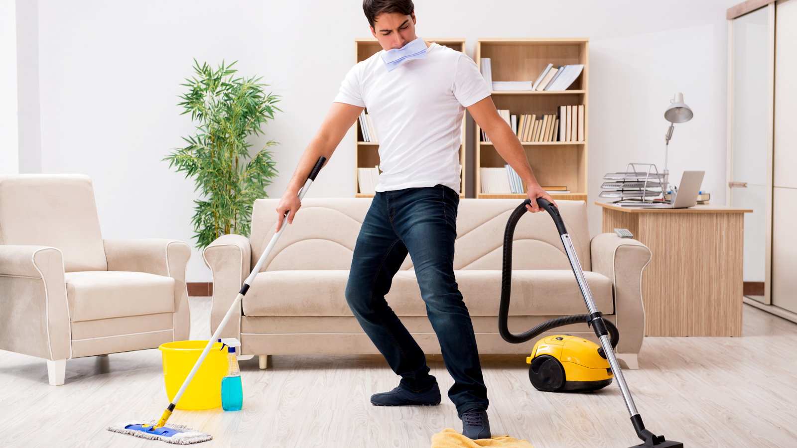man vacuuming