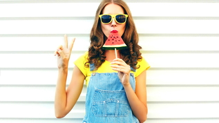 girl eating watermelon popsicle