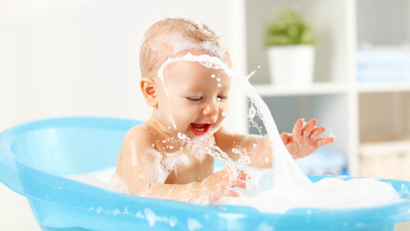 baby playing in baby bath