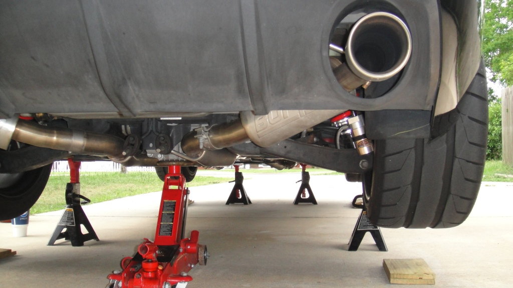Raise and secure the car on four jack stands.