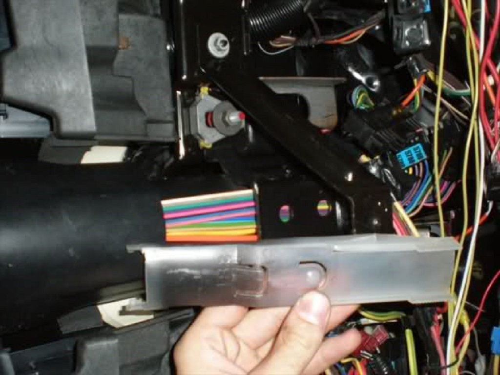 View looking up at the lower steering column with the plastic shielding removed