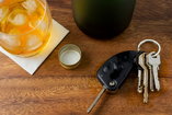 car keys next to an alcoholic beverage