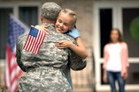 military personnel leaves his family for deployment