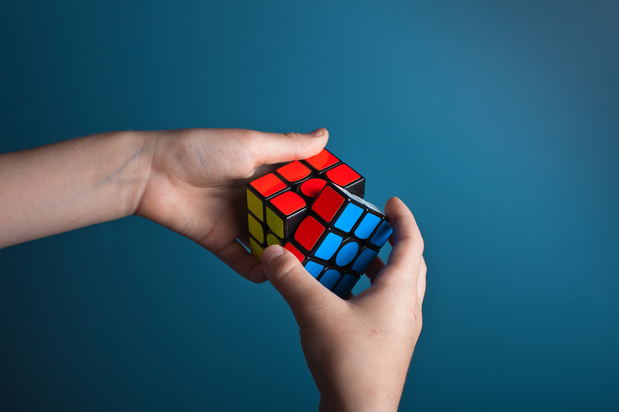person solving a rubix cube