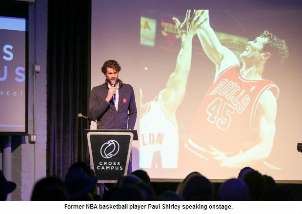 Former NBA basketball player Paul Shirley speaking on stage.