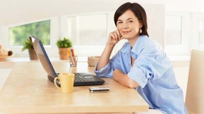 Woman sitting in home office.