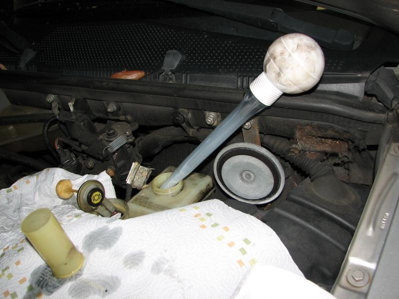 Use your turkey baster to remove fluid from brake fluid reservoir