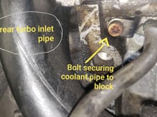 This is the location of the bolt for the coolant line where it is secured to the block.
