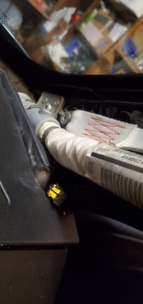 connector hanging next to airbag