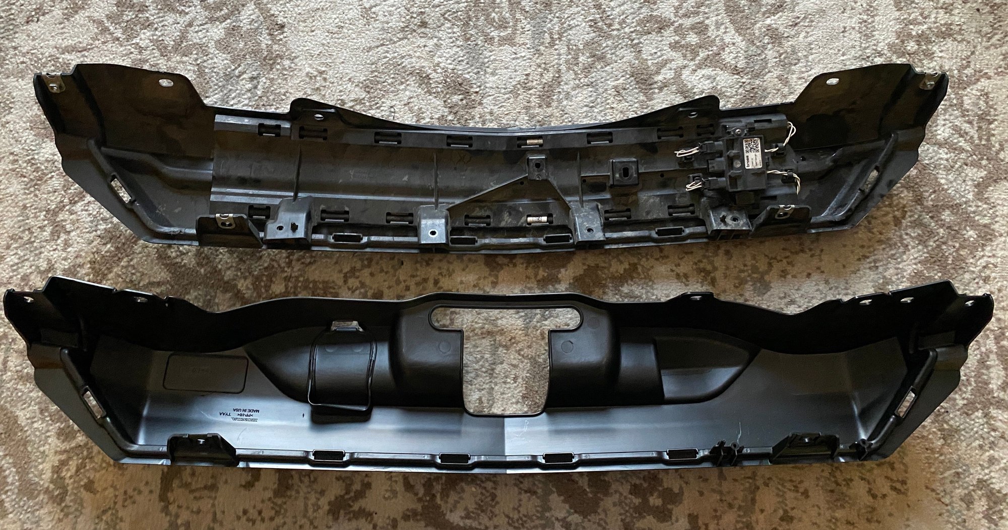 This shows the original trim panel (top) with the HFS module attached compared to the new trim panel (bottom).