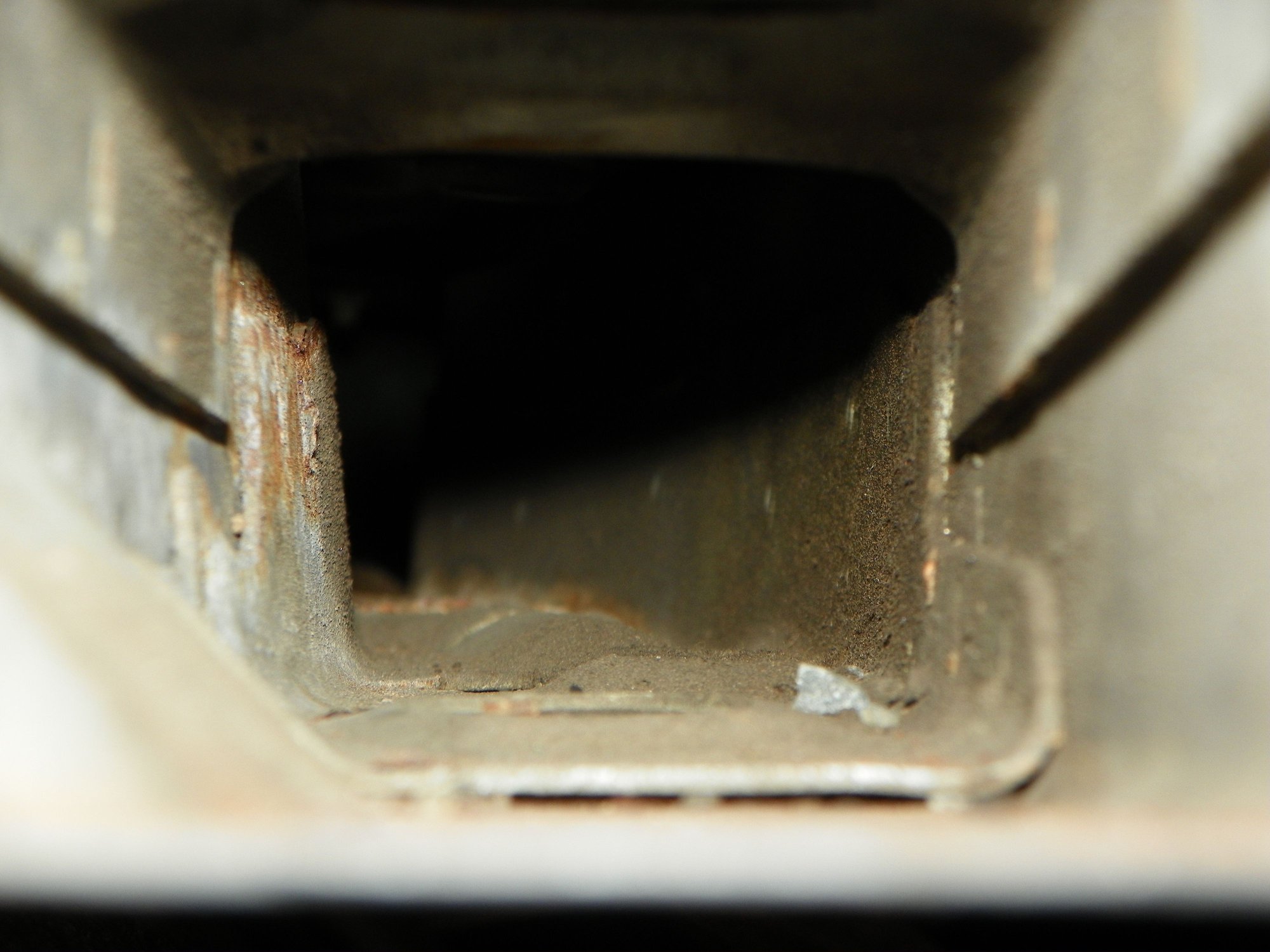 Inside of right frame where the crash bar inserts. Not bad. Some salt residue and surface rust is there.