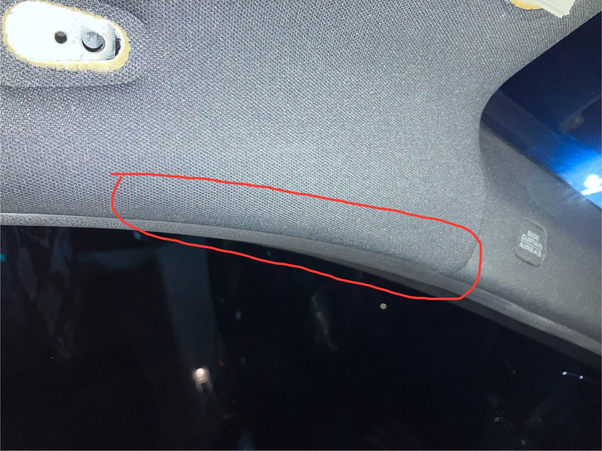 It would start essentially just below the grab handle as shown in the picture and stop at the crease where the headliner and A-pillar butt up to each other. 