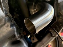Clears shaft just fine. There is about 2" of spacing from the shaft and subframe to the exhaust.
