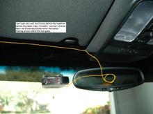 Wire tucks above the headliner, loops around the mirror mount and goes to the radar detector. forward view