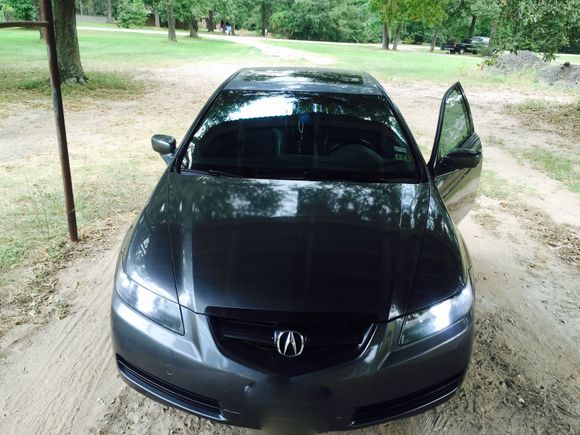 here is the pic of the blacked out headlights with NEW switchback bulbs and grille