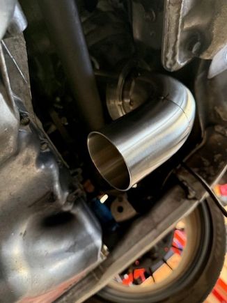 Clears shaft just fine. There is about 2" of spacing from the shaft and subframe to the exhaust.