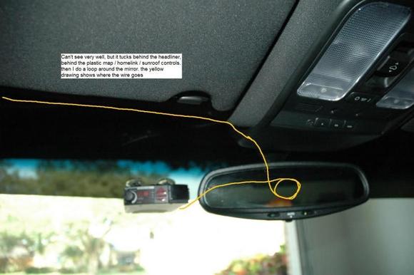 Wire tucks above the headliner, loops around the mirror mount and goes to the radar detector. forward view