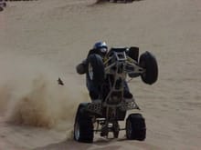 My bro bustin a big wheelie on my shee. How the hell does he stay so straight up and down....almost upside down....                                                                                     