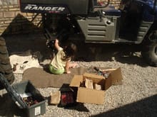 RAERAE WORKING HARD TO KEEP DADDY FROM LAYING HIS RANGER ON ITS SIDE SHE'S INSTALLING THREE &quot; WHEEL SPACERS.MADE BY THE TRAX CO.                                                                   