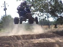 I'm always off the back of the quad in the air...May seem like weird body position but it works for me                                                                                                  