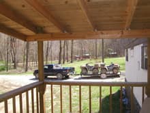 Cabins (Hatfield and McCoy) looking out from our porch to our wheelers on the trailer.
