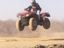 Me in local hare scramble on the Rancher ;p - the ultimate racing machine! lol