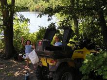 The wheeler and the girls at the lake. This lake has no real roads leading into it so it is almost always empty. We have never ran into anyone while w                                                  
