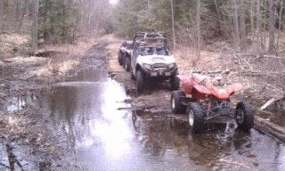 Plenty of muddy/flooded trails.  This one is not a puddle, thats actually water from the beaver dam overflowing the trail.