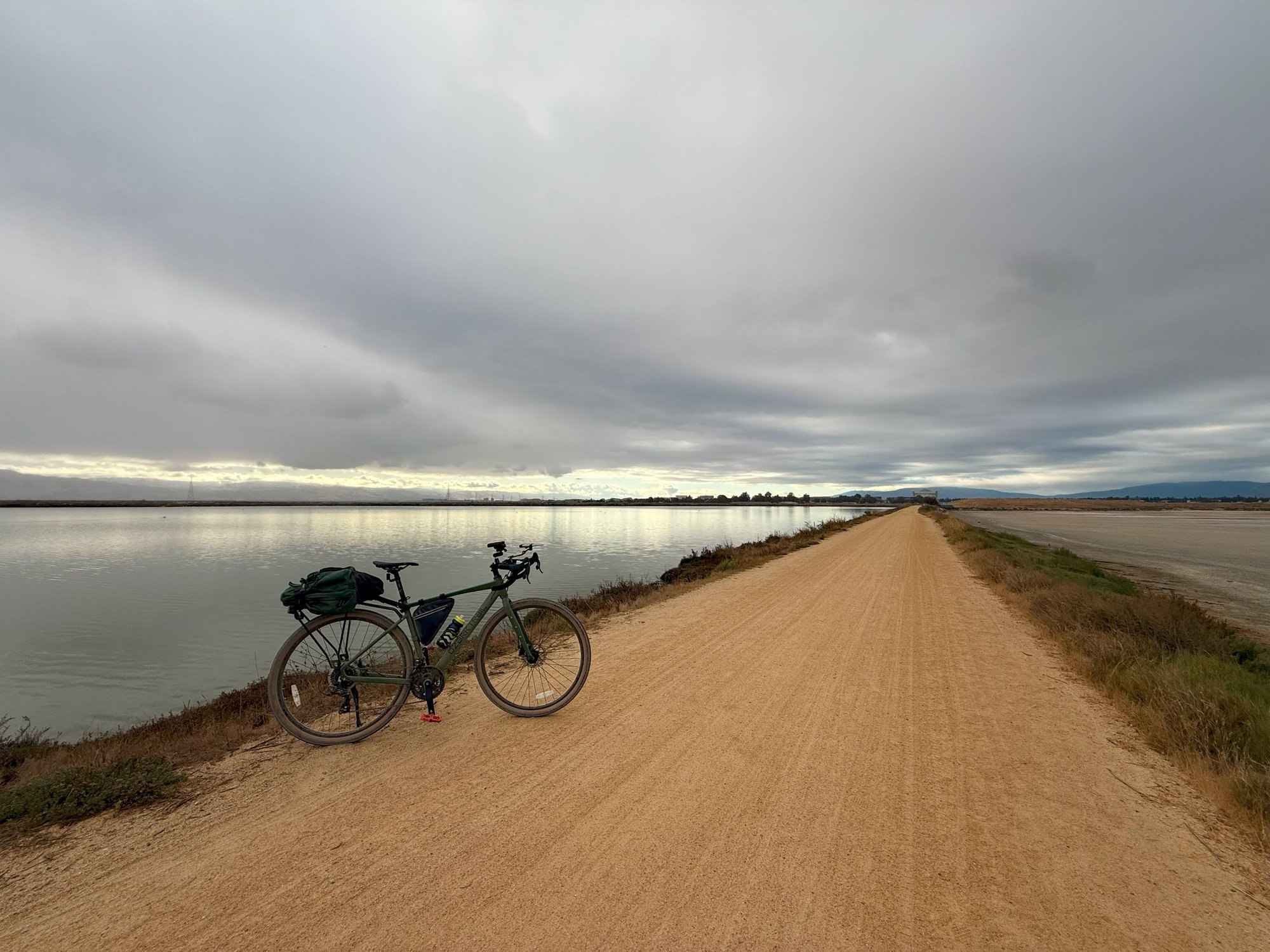 Finally found the right commuter.  Dirt cheap Walmart Ozark Trail G.1 Explorer for $288.  Works great as commuter.  More efficient and faster, especially going into headwind.