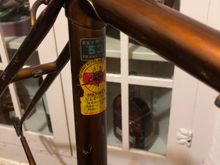 Plenty of patina, faded paint, and paint scrapes; still, no dents and the missing decals are replaceable. With proper care this can still be a nice looking frame.