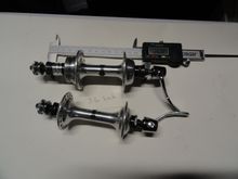 Set A:  SR low flange hubs 36hole 126 over-nut length. Curved QR levers and new end caps.  $120 shipped with USPS.