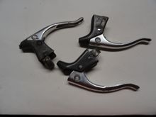 The three levers form Shop Dog Bikes.   Not the broken one on the left side.  Pretty crusty but I think they will work.