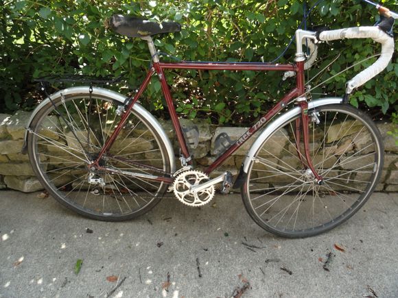 Early '80's Trek 720.  Compact touring geometry with some old skool Helicomatic hubs.  Most parts are showing some wear possibly from age.  Was supposedly  a garage queen but still some good parts left.