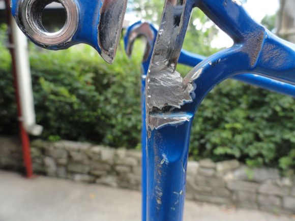 The rear drop out with a bunch of slag removed and part of the yoke filled in the process.  I thin the excess material in the yoke will reinforce the weld area significantly.