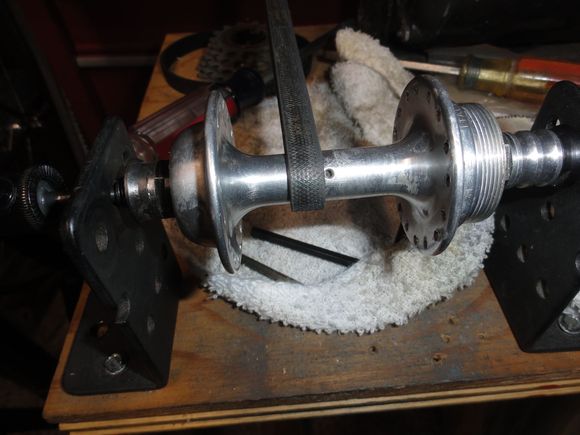 The hub in the polishing mechanism.  It is a 1/2 hp motor with a vacuum cleaner belt that wraps around the hub shell. note the oxidized aluminum on the shell.