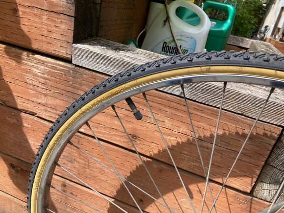 A 27" steel rim with cheap tires