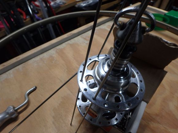 Our first poke is in place and now all of the other spokes for the drive or pulling spokes go into the hub.