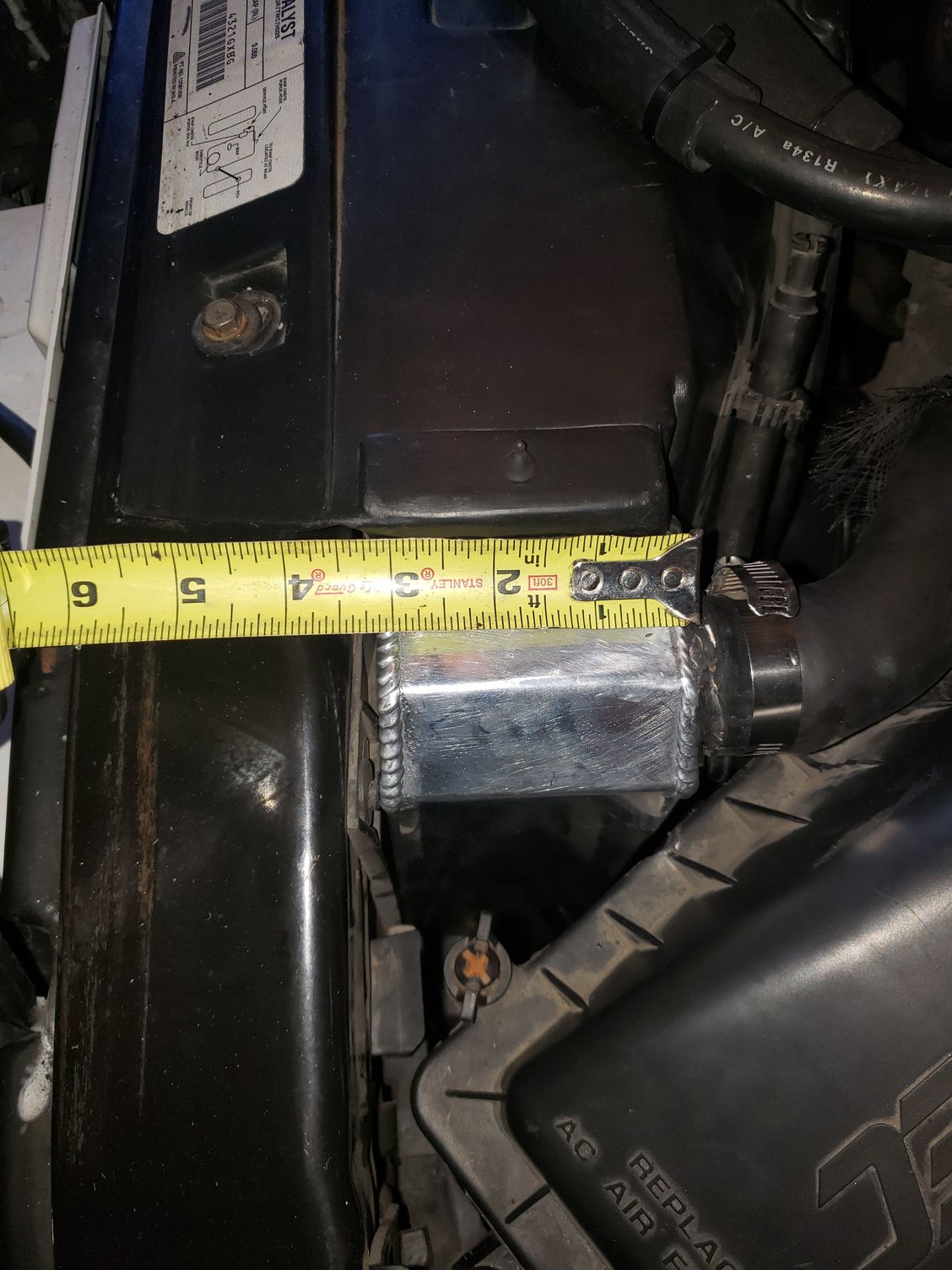 The measurement of the front-back thickness of the Champion 4-row radiator.