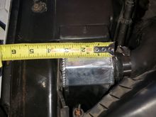 The measurement of the front-back thickness of the Champion 4-row radiator.