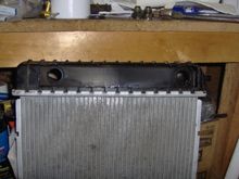 The front-facing side of the radiator. The top of the radiator is to the left. I used my Dremel tool to cut away the plastic. 
 
