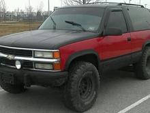 BEFORE, win i got it, it was all red so i threw some black on there and some 35s no lift