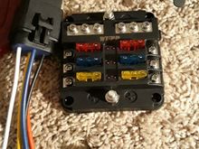 The fuse distribution block thsts going in upper center console, and relay for ignition switched power