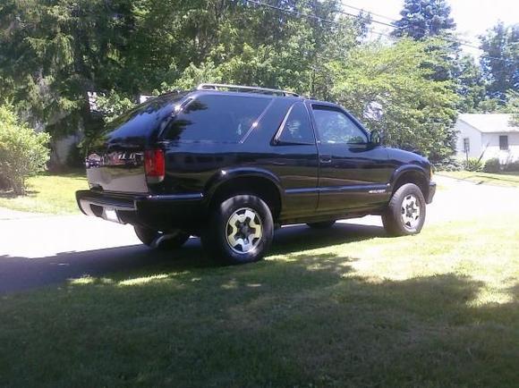 should i put the gate for the spare tire back on or bondo &amp; repaint the side and back?