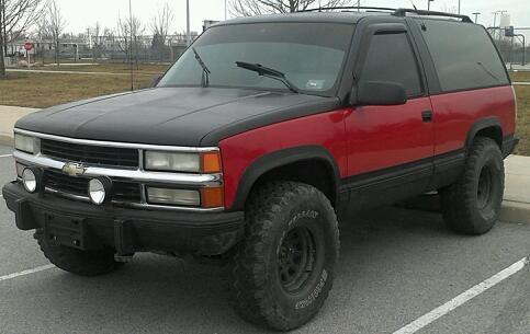 BEFORE, win i got it, it was all red so i threw some black on there and some 35s no lift