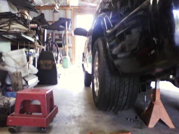 8.8 31 spline axles,shortened,completely rebuilt with slotted cross drilled rotors, hi-perf, ceramic pads and dual piston calipers, new Ford Racing 4.11 gear and Strange Spool. with new 15x10 rims and 295/50r15 tires.