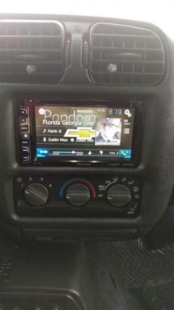 Double din Pioneer AVH-X2700BS DVD with Bluetooth and mirrorlink. Backup camera is also installed and wired into the radio.

Also have the 03-up dash bezel to get the double din opening and hand made steel mounting brackets and hand made rubber radio support bracket. Sorry no pics of the custom mounting hardware.