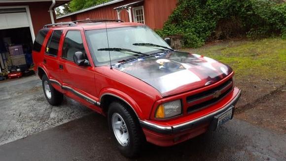 Minor side damage from a parking lot accident.