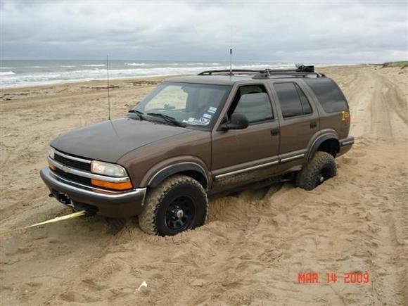 ok ok... I fat fingered the 2wd button when shifting it out of park.  I didn't notice I was in 2wd till after I got unstuck.  yea yea, I know