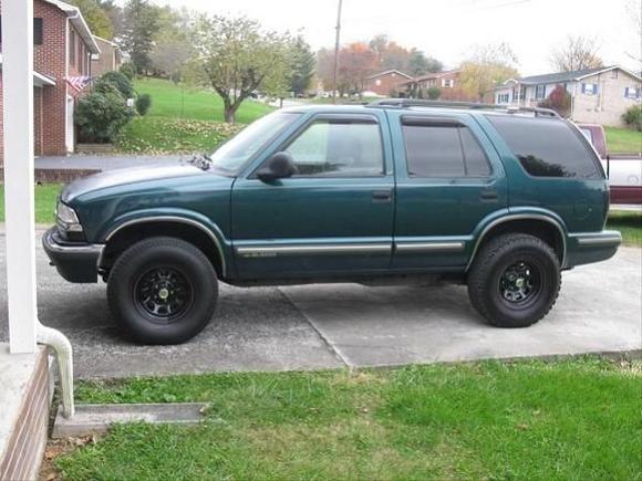 blazer after black out taillights and signal lights, new chrome center caps and lug nuts