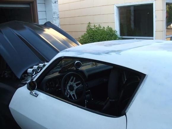 Welded in the old sunroof hole using donor roof from a '75 Firebird.